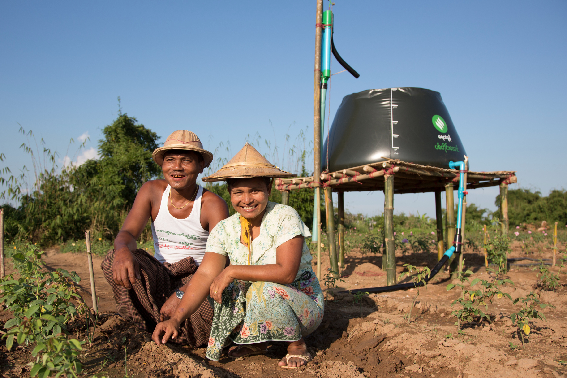 Photograph © Tim Mitzman for Proximity Designs 2013 Proximity Designs' water basket in farm use: using a treadle pump, farmers can collect and move water and then distribute it by hose or drip irrigation lines—huge improvements in time and labor compared to bearing buckets of water on their shoulders with a wooden yoke.