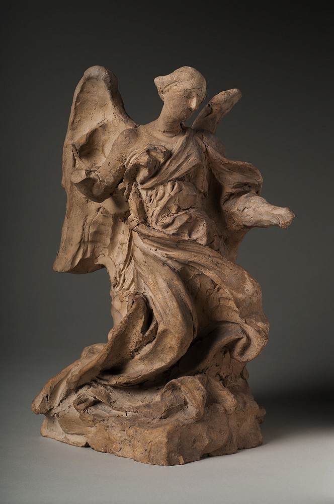 A sculpture of a standing angel. 