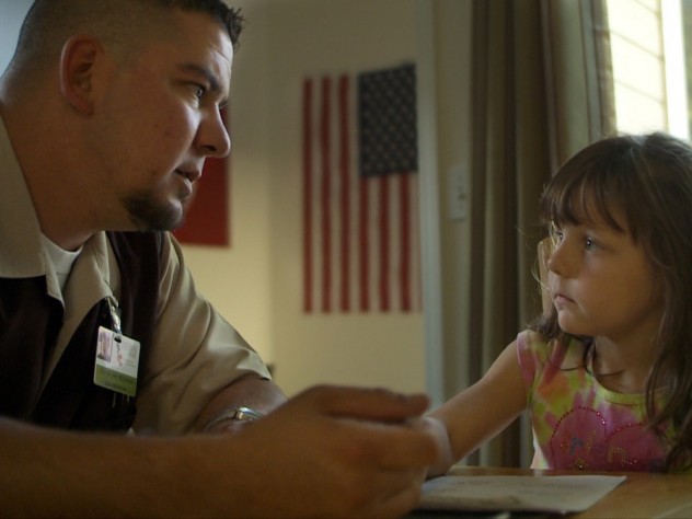 A veteran's daughter visits with her father.
