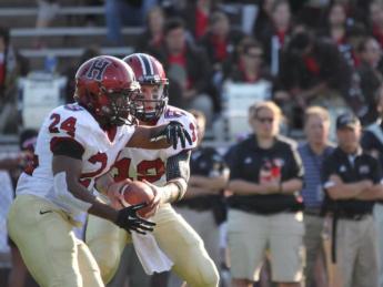 <b>One-two punch:</b> Between them, running back Treavor Scales (24) and quarterback Colton Chapple (19) accounted for six touchdowns in Harvard's 45-31 victory over Brown.