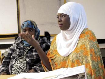 Zahara Haji (foreground) and Amina Abdullahi, research assistants in Betancourt’s project with the Somali Bantu refugee community in Boston, during a presentation at Chelsea City Hall  