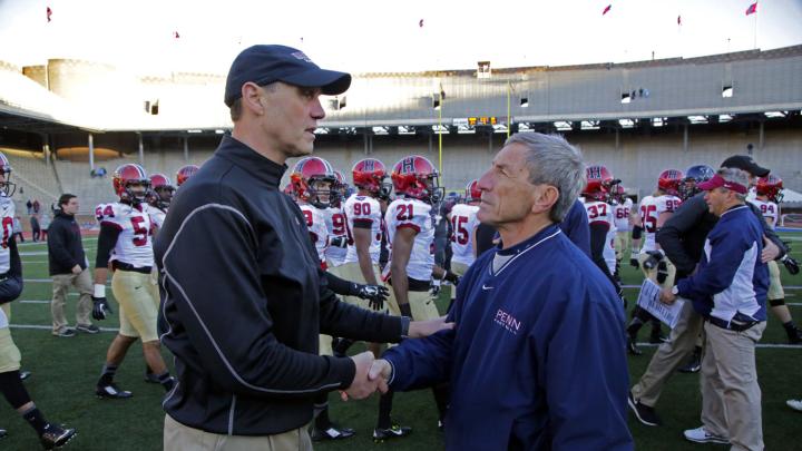 Hail and farewell: After the game, Harvard coach Tim Murphy (left) saluted Penn’s Al Bagnoli, who had just coached his final game at Franklin Field after 23 seasons and nine Ivy titles. His Quaker rival, said Murphy, “is the standard by which they’ll measure all Ivy coaches in this era.” 