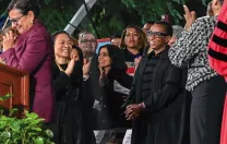 Senior fellow Penny Pritzker and President Claudine Gay on stage during Gay’s installation
