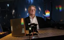 Instrument designer Andrew Szentgyorgyi illustrates the prism technology for the GMT’s high-resolution spectrograph.