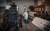 Statue of a woman working in a textile mill  