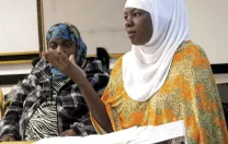 Zahara Haji (foreground) and Amina Abdullahi, research assistants in Betancourt’s project with the Somali Bantu refugee community in Boston, during a presentation at Chelsea City Hall  