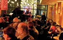 The Mad Monkfish's stage viewed from the back of a room