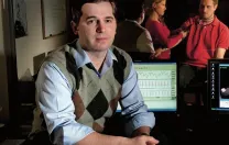 Matthew Nock sits in his lab’s control room, where researchers record subjects’ behavioral and physiological responses during experiments. For example, they might measure whether people who engage in self-injury show greater emotional distress, in response to frustrating tasks, than people who do not. (Nock’s lab manager and a postdoctoral fellow are seen in the adjoining room through one-way glass.)