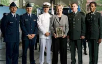 At the ROTC ceremony, from left to right: U.S. Air Force second lieutenants Roberto A. Guerra and Michael J. Arth, U.S. Navy ensign John D. Reed, President Faust, and U.S. Army second lieutenants Jason M. Scherer and J. Danielle Williams.