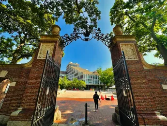 View of Harvard Science Center through a gate