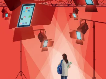 Student walking under bright stage lights shaped like smartphones displaying social media apps.