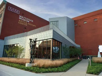 glass and steel addition to a traditional brick building that houses the Mattatuck Museum