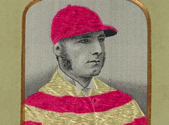 Portrait of Tom Cannon in a striped jockey uniform and matching cap.