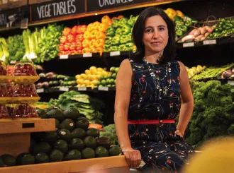Emily Broad Leib in front of produce 