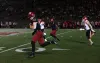 Harvard player runs with the ball with other players in pursuit