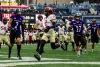 Harvard player running with ball into end zone