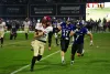 Harvard player running with ball with Holy Cross players in pursuit