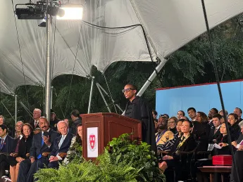 Claudine Gay at the podium addresses audience