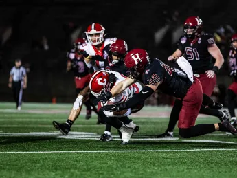 Harvard football player tackles Cornell linebacker who has the ball