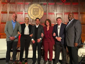 The "Fab Five of Harvard Sports" panelists: (left to right) Ben Crockett ’02, Allison Feaster ’98, Don Sweeney ’88, Jessica Gelman ’97, M.B.A. ’02, and TKTKTK.