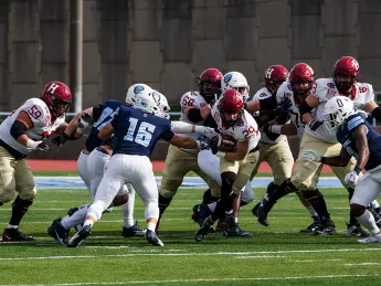 Harvard offense has the ball with Columbia defense in pursuit