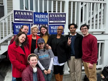 Harvard Democrats members campaigning outside alongside Sen. Warren and Rep. Ayanna Pressley (D-MA).
