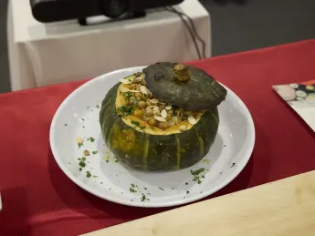 A squash, scooped, with a barley dish inside