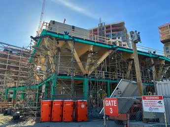 Construction site of a wood building that is two stories 