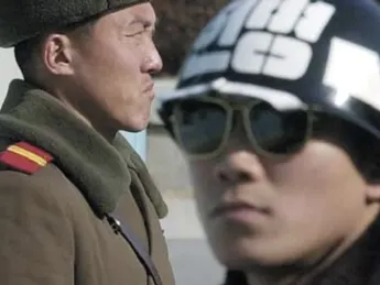North Korean (left) and South Korean soldiers on guard in the Demilitarized Zone, just a few miles and minutes from Seoul’s suburbs.