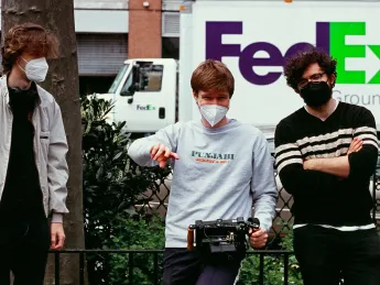 Jacob Roberts with other colleagues filming with equipment