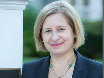 Ann Marie Lipinski stands at the entrance to the Nieman Foundation
