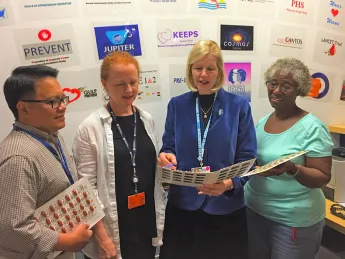 JoAnn Manson (center, in blue) meeting with research staff 