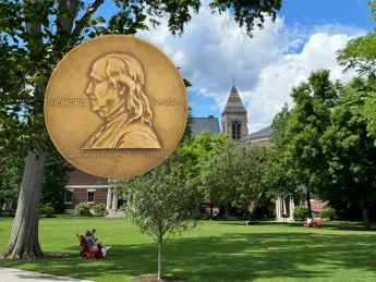 Pulitzer Prize in the foreground with Radcliffe Institute in the background 