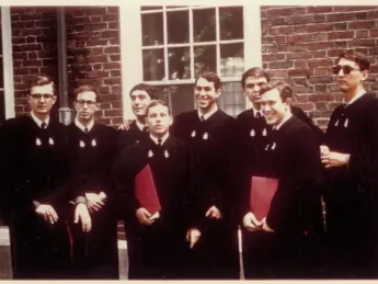 Harvard graduates gather outside in 1965