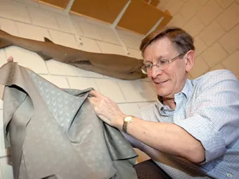 Harvard ichthyologist George Lauder holds up a "sharkskin" swimsuit