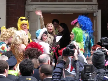 Actress Claire Danes waves to an animated crowd before entering Farkas Hall.