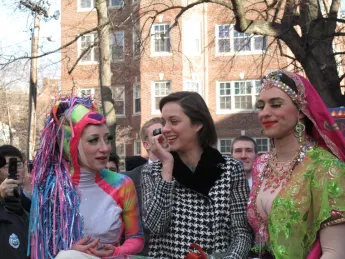 Marion Cotillard with members of the Hasty Pudding Theatricals before entering Harvard Square.