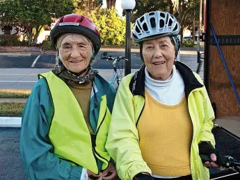 While cycling the East Coast Greenway, Linda Cabot Black and Elizabeth Brody pause for some Florida sunshine. 