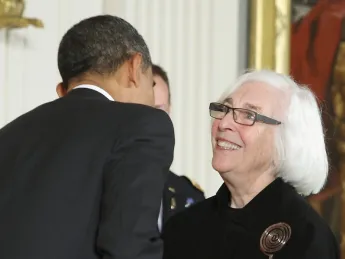 Emily Rauh Pulitzer receives her medal from President Obama at the White House on February 13, 2012.
