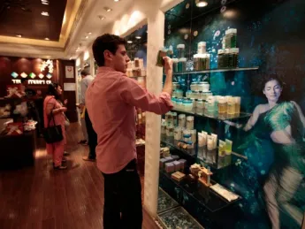 Considering how to position a new product line involves becoming acquainted with other products on the market. M.B.A. student Frederic Dijols reads product descriptions at The Nature's Co., a chain store that emphasizes use of natural ingredients and the influence of Ayurveda (Indian traditional medicine). 