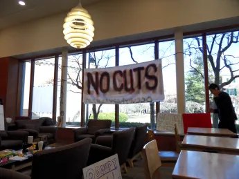 Demonstrators in Lamont Café protested possible cuts to library staff.
