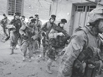 Moulton (at right) leads a mission in Najaf.