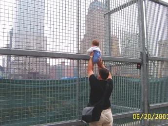 A former resident of the neighborhood and his son revisit the World Trade Center site for the first time. 