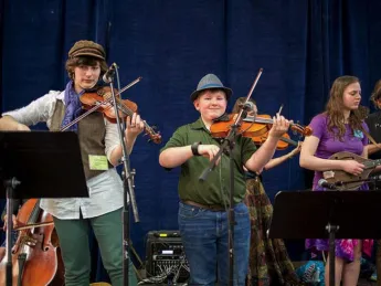 Three fiddlers playing