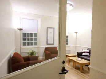A life-size model of a renovated Old Quincy suite includes a hallway, a "cluster" common room, a bathroom, a single bedroom, and a double bedroom set up in the parking garage at One Western Avenue, where contractors, architects and administrators can tour the mock-up. Click the "right arrow" below or use the arrow buttons on your keyboard to see more images.
