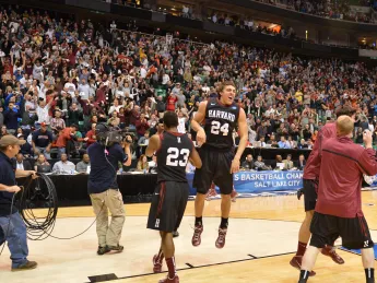 The celebrating fourteenth-seeded Harvard Crimson led almost the entire game and held off a late New Mexico rally to top the third-seeded Lobos, 68-62.