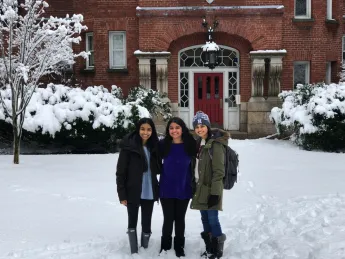 The author and her two roommates stand in the snow in front of their future home at Harvard.