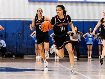 Harmoni Turner dribbles the ball up the court 