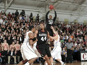 Standout players Kyle Casey (30) and Keith Wright (44) in action as Harvard, in its final home game, beat Princeton 79-67 to clinch a share of the Ivy league championship.