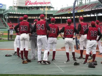 Harvard players near the batting cage.